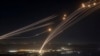 TOPSHOT - Rockets fired from southern Lebanon are intercepted by Israel's Iron Dome air defence system over the Upper Galilee region in northern Israel, on August 4, 2024, amid ongoing cross-border clashes between Israeli troops and Lebanon's Hezbollah fi