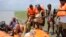 National Disaster Response Force (NDRF) personnel evacuate villagers at Supaul district in the eastern Indian state of Bihar, August 3, 2014. 