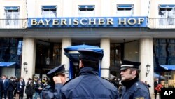 German police officers stand in front of the Bayerischer Hot hotel on the first day of the Munich Security Conference in Munich, Germany, Feb. 14, 2020. 