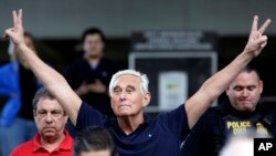 FILE - Former Trump campaign adviser Roger Stone walks out of a federal courthouse following a hearing, Jan. 25, 2019, in Fort Lauderdale, Fla.