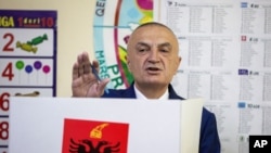 FILE - Then-Albanian President Ilir Meta gestures as he votes during parliamentary elections in the capital Tirana, Albania, April 25, 2021.