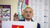FILE - Albanian President Ilir Meta gestures as he votes during parliamentary elections in the capital Tirana, Albania, April 25, 2021.