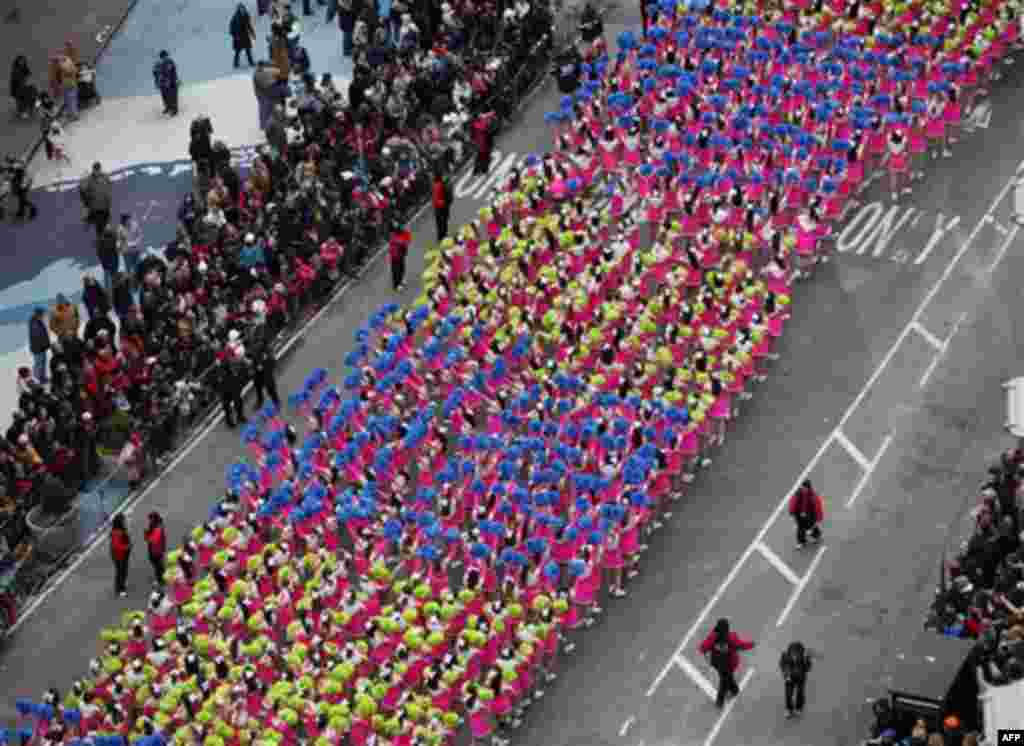 A group of cheerleaders performs during the Macy's Thanksgiving Day parade in New York, Thursday, Nov. 25, 2010. (AP Photo/Jeff Christensen)
