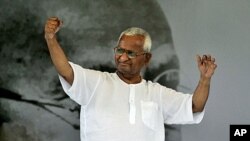 India's anti-corruption activist Anna Hazare greets his supporters during the 12th day of his hunger strike in New Delhi, India, August 27, 2011