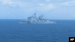 FILE - This undated photo released Sept. 15, 2020, by Indonesian Maritime Security Agency (BAKAMLA) shows a Chinese Cost Guard ship sailing in North Natuna Sea.