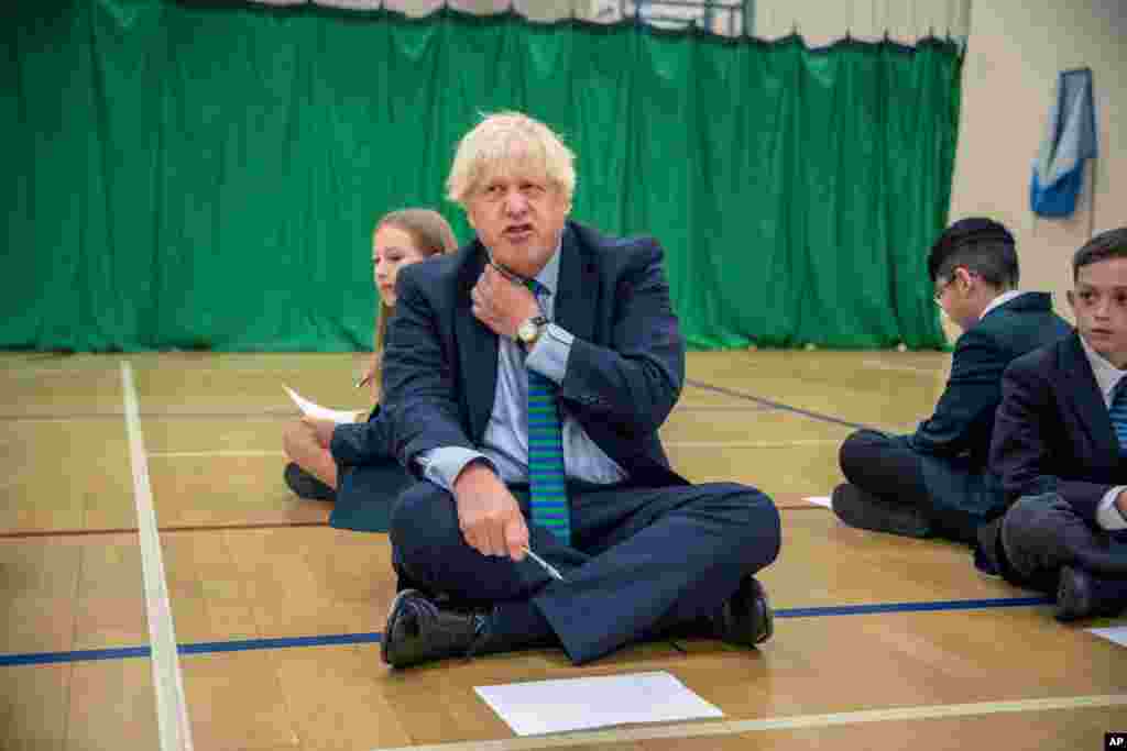 Britain&#39;s Prime Minister Boris Johnson gestures during a visit to Castle Rock school on the pupils&#39; first day back, in Coalville, East Midlands, England.