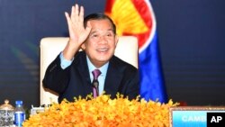 FILE - In this photo provided by the An Khoun Sam Aun/National Television of Cambodia, Cambodian Prime Minister Hun Sen joins an online meeting of the ASEAN-China special summit at Peace Palace in Phnom Penh, Cambodia, Nov. 22, 2021. 