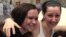 Amanda Berry, right, hugs her sister Beth Serrano after being reunited in a Cleveland hospital Monday May 6, 2013.