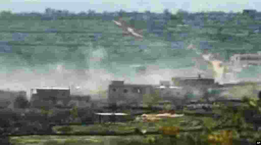 This image made from amateur video March 28, 2012, purports to show smoke from shelling in Idlib, Syria, March 28, 2012. (AP/Ugarit)