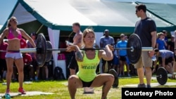 A CrossFit athlete, Christmas Abbott, in Washington, D.C. exercises with weights. (Photo: Michael J. LaPierre)