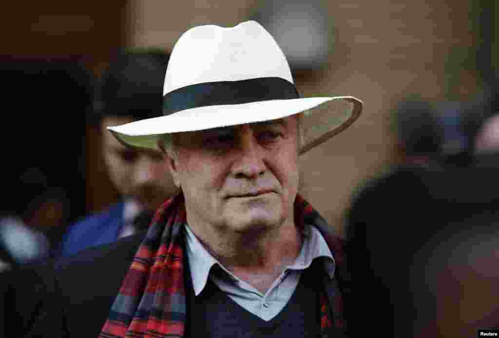 Henke Pistorius, father of Oscar Pistorius, leaves after listening to the closing arguments in his son&#39;s murder trial at the high court, in Pretoria, Aug. 7, 2014.