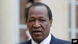 Blaise Compaore, who at the time was Burkina Faso's president, speaks to reporters in Paris, Sept. 18, 2012.