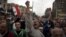 Egyptian protesters chant anti-Muslim Brotherhood slogans during a rally in front of the presidential palace, in Cairo, Egypt, Dec. 4, 2012.