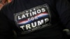 FILE - A supporter wearing a "Latinos for Trump" T-shirt attends U.S. President Donald Trump's campaign rally in Wildwood, New Jersey, Jan. 28, 2020. 