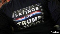 FILE - A supporter wearing a "Latinos for Trump" T-shirt attends U.S. President Donald Trump's campaign rally in Wildwood, New Jersey, Jan. 28, 2020. 
