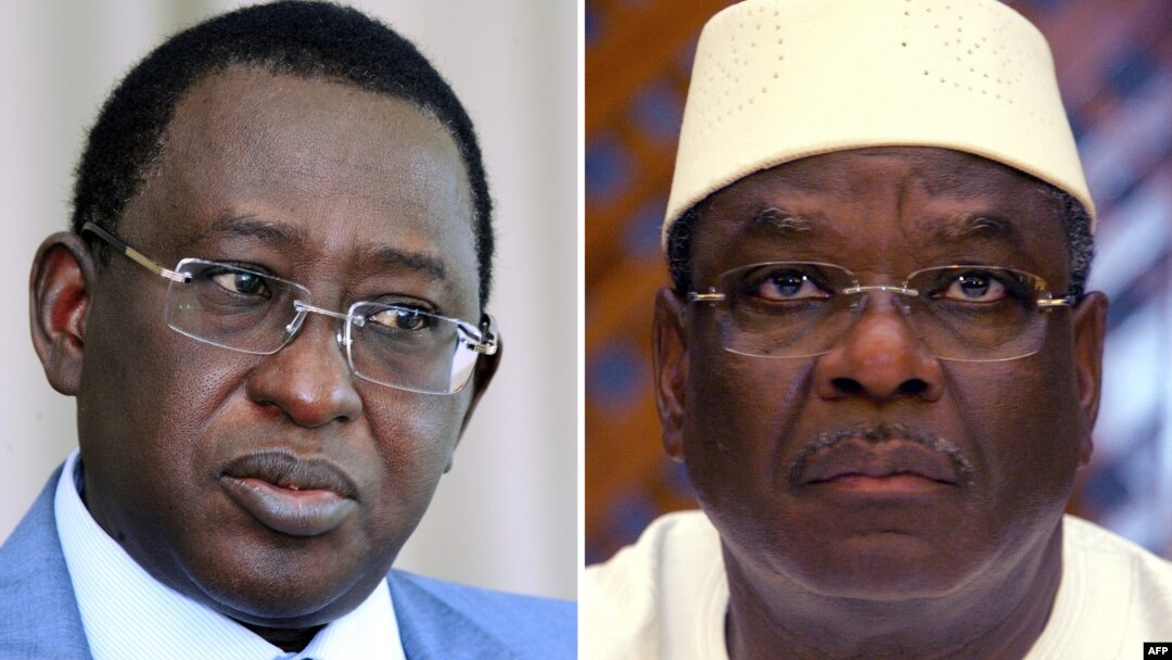 This combination of two file pictures shows (at L) Malian presidential candidate, Soumaila Cisse, and (at R) Malian presidential candidate Ibrahim Boubacar Keita, dubbed IBK. 