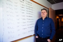 FILE - Oren Etzioni poses for photos at the Allen Institute for Artificial Intelligence where he serves as advisor & board member, Decemember. 8, 2023, in Seattle.