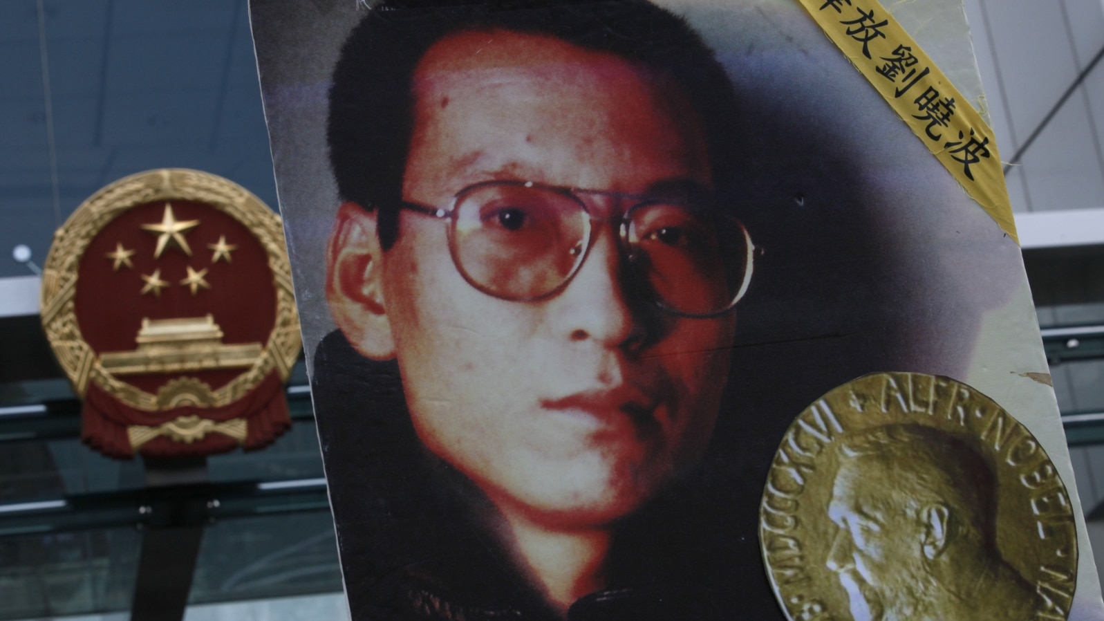 FILE - A picture of Chinese dissident Liu Xiaobo is shown outside the China's Liaison Office in Hong Kong, Oct. 11, 2010. 