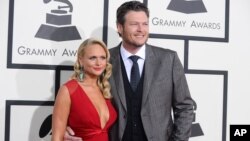 FILE - Miranda Lambert, left, and Blake Shelton arrive at the 56th annual Grammy Awards at the Staples Center in Los Angeles, Jan. 26, 2014.