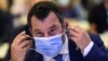 Italian federal secretary of Lega party and former deputy prime minister of Italy Matteo Salvini puts a face mask on during the closing ceremony of the third Chega National Congress in Coimbra, on May 30, 2021.