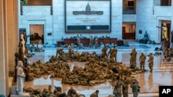 Hundreds of National Guard troops rest inside the Capitol Visitor&#39;s Center in Washington, D.C.