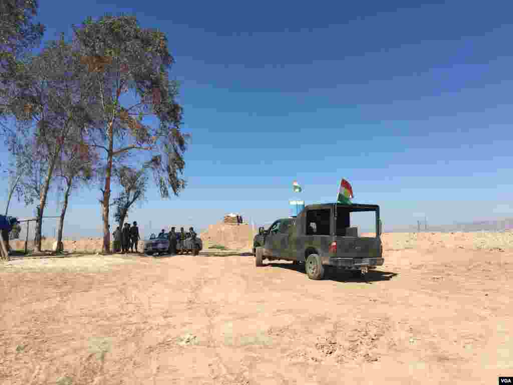 Iraqi Kurdish Peshmerga standing near one of the their lookout posts that straddles the frontline against the Islamic State in the area of Makhmour. Makhmour is expected to be one of the staging points for Iraqi and Peshmerga forces to advance on the IS-c