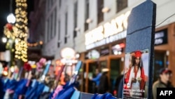 A cross with a picture of 18-year-old victim Ni’Kyra Cheyenne Dedeaux is seen at a memorial on Bourbon Street after it reopened to the public on January 2, 2025, in New Orleans, Louisiana, following an attack on January 1 which left 14 dead.