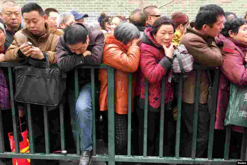 Petitioners stand in a line to enter the State Bureau For Petitions and Visits, which handles applications from petitioners from all over China, in Beijing. Every year petitioners from across the country come to Beijing hoping members of parliament can help them with their grievances.