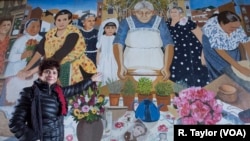 Diane Modica points to her younger self, standing beside her late "nonna," an early 20th-century immigrant from Sicily. She and her grandmother were included in the City of Boston's "Immigrant Grandmothers" mural in East Boston. 