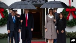 President Donald Trump and first lady Melania Trump pose for photos with Guatemalan President Jimmy Morales and his wife Patricia Marroquin de Morales at the White House, Tuesday, Dec. 17, 2019, in Washington.