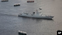 The Jinan, destroyer of People's Liberation Army (PLA) sails past Hong Kong's Victoria Habour, Tuesday, July 11, 2017. (AP Photo/Vincent Yu)