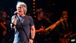 FILE - Jon Bon Jovi performs at the Beacon Theatre in New York, June 3, 2021.