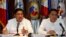 Philippine chief government negotiator Carlos Sorreta (L) speaks next to Pio Lorenzo Batino, Philippine Department of National Defense, Undersecretary for Legal and Legislative Affairs and Strategic Concerns during a news conference at the military headqu