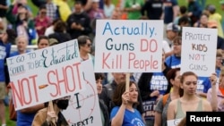 People participate in the 'March for Our Lives' rally against gun violence