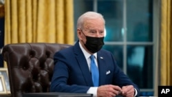 FILE - U.S. President Joe Biden speaks in the Oval Office of the White House in Washington, Feb. 2, 2021. 