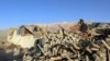 In this photo released by Xinhua News Agency, people stand amidst damaged houses in the aftermath of an earthquake in Tonglai Village, Changsuo Township of Dingri in Xigaze, southwestern China's Tibet Autonomous Region on Jan. 7, 2025. 