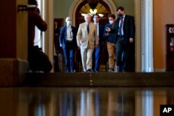Senate Minority Leader Mitch McConnell of Kentucky walks off the Senate floor in Washington, Aug. 9, 2021.