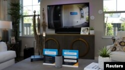 An Amazon Echo displays a video feed of the front door on a TV in the living room of an Amazon "experience center" in Vallejo, California, May 8, 2018. 