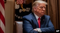 FILE - President Donald Trump listens during a White House meeting in Washington, July 9, 2020. On Thursday, a federal judge dismissed a lawsuit by Trump seeking to block the release of eight years of his personal and corporate tax records. 