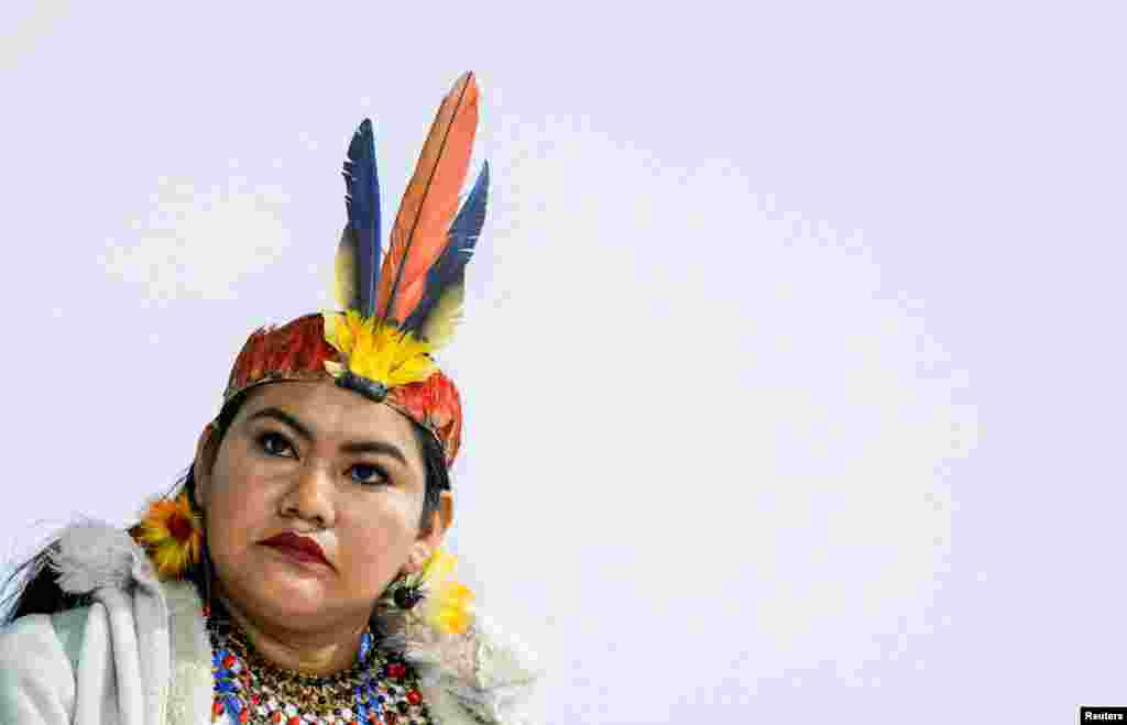 A woman looks on during the indigenous people&#39;s protest during the United Nations Climate Change Conference (COP29), in Baku, Azerbaijan.