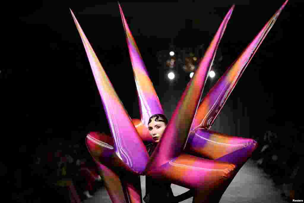 A model presents a creation during the &quot;On/Off presents Jack Irving&quot; catwalk show at London Fashion Week in London, Britain.