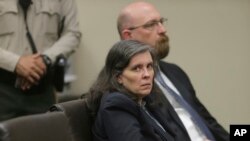 Louise Turpin and her attorney, Jeff Moore, appear in court for a conference about their case in Riverside, Calif., Feb. 23, 2018. 