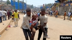 FILE - A man injured in an explosion at an M23 rally is evacuated from the scene in Bukavu, Democratic Republic of Congo, on Feb. 27, 2025. The Angolan government said on March 12, 2025, that the M23 rebels and the DRC government will enter direct peace talks.