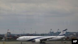 FILE - El Al Airlines Flight 28 races on the runway at Newark Liberty International Airport moments before taking off en route to Tel Aviv's Ben Gurion Airport, July 24, 2014, in Newark, N.J. 