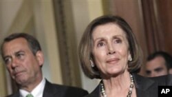 House Speaker House John Boehner of Ohio, left, stands next to House Minority Leader Nancy Pelosi of Calif., on Capitol Hill in Washington, Wednesday, April 6, 2011, during a break from work on the federal budget.