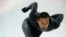 Shani Davis of the U.S. skates in the prototype of the official US Speedskating suit during a training session at the Adler Arena Skating Center at the 2014 Winter Olympics, Feb. 14, 2014.