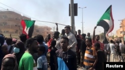 FILE - Protesters gather during what the Information Ministry calls a military coup in Khartoum, Sudan, Oct. 25, 2021. 