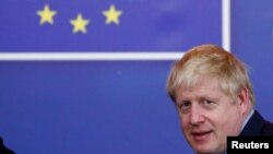 Britain's Prime Minister Boris Johnson leaves the European Council after the Brexit-dominated European Union leaders summit in Brussels, Belgium Oct. 18, 2019. 