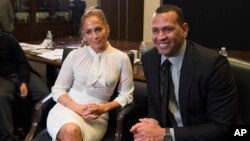 FILE - Alex Rodriguez, left, and Jennifer Lopez participate in a panel at Project Destined Bronx Bootcamp at Yankee Stadium in New York, March 4, 2018.