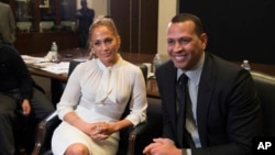 FILE - Alex Rodriguez, left, and Jennifer Lopez participate in a panel at Project Destined Bronx Bootcamp at Yankee Stadium in New York, March 4, 2018.